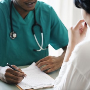 Doctor diagnose patient symptoms at the hospital