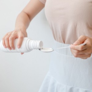 women-pouring-drugs-antacids-their-hands-because-food-from-their-hands-bottle_73852-122